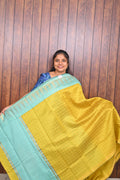 Raw Silk Saree SLM-RSL-0004 - Mustard yellow with an aqua border and pallu - front view