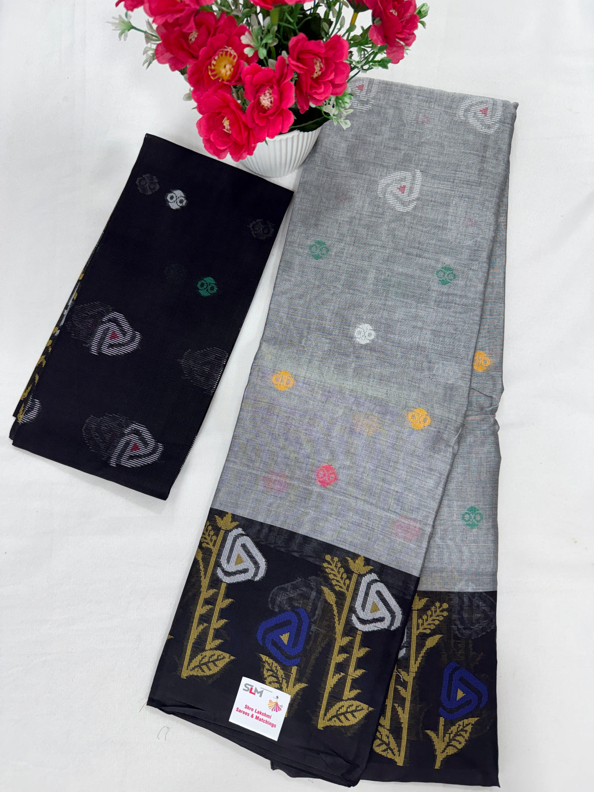 Silk Cotton Saree SLM-SCT-0057 - Light grey with a black border and floral motifs