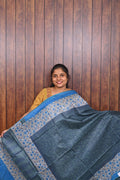 Semi Tussar Saree SLM-STS-0019 - Slate blue with a printed floral border and blue edging - front view