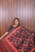 Semi Tussar Saree SLM-STS-0047 - Black with coral floral print and a coral border - front view