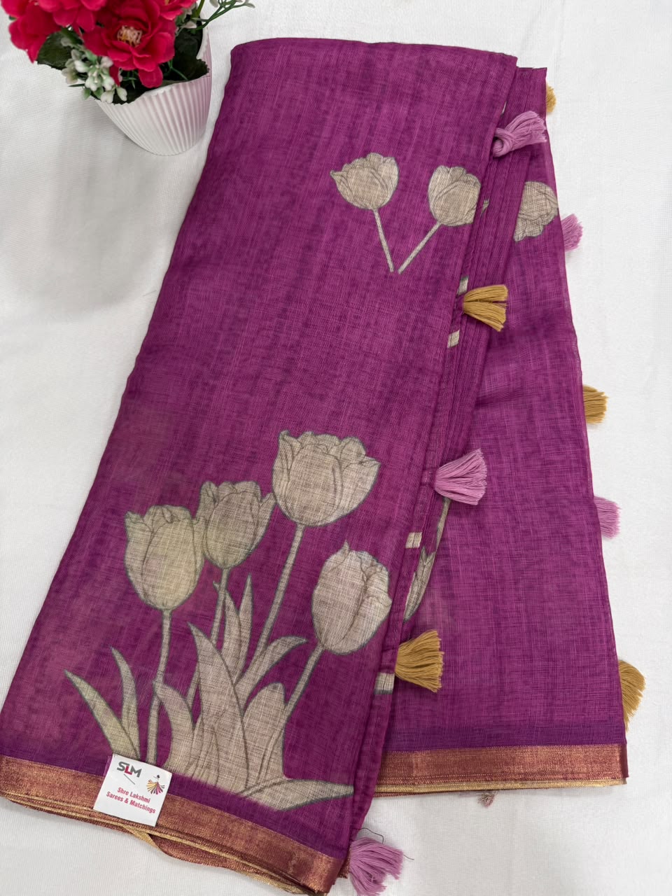 Magenta tulip print saree full view with copper zari border and tassels