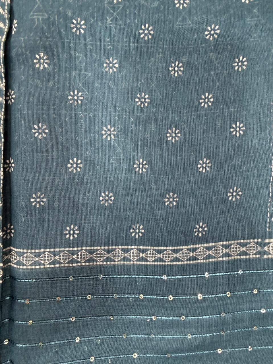 Teal blue dark floral leaf print saree close-up ikat pattern and border