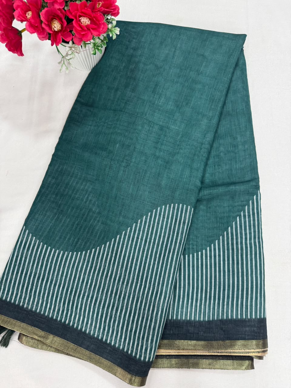 Silver grey plain texture saree close-up fabric with striped border